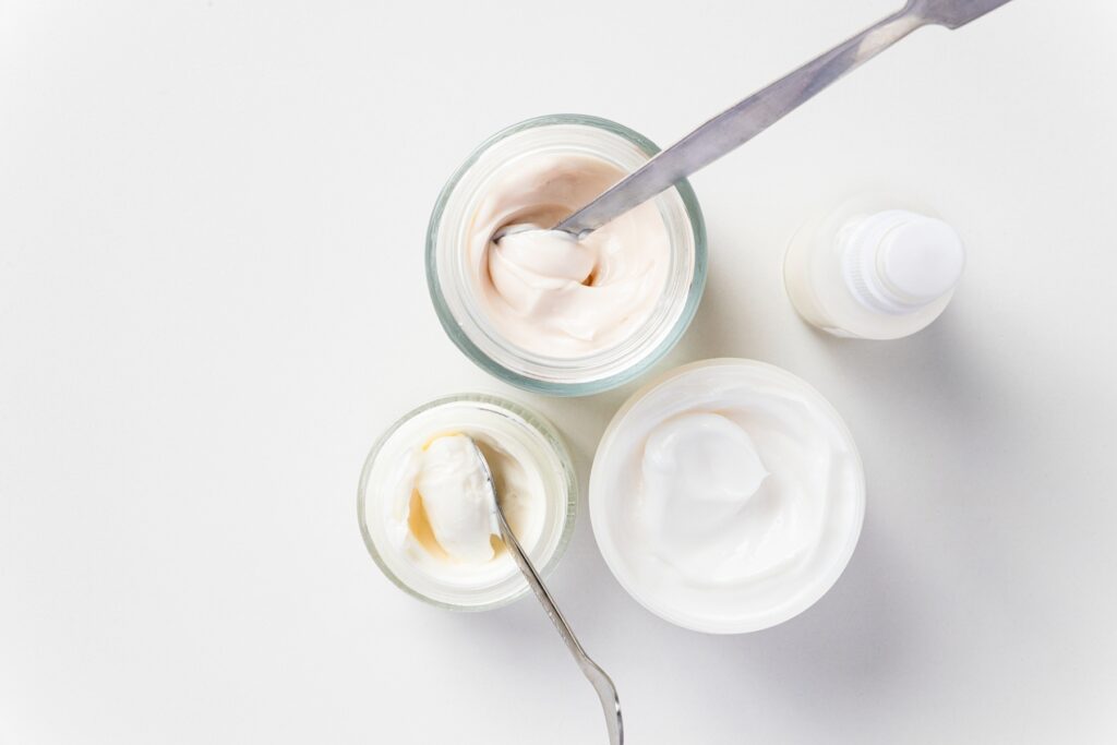 Jars and bottle containing private label body lotion.